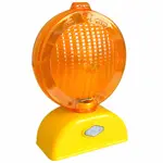 A yellow traffic light with an orange lamp on top of it.